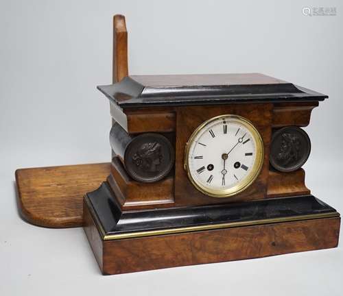 A Victorian walnut and ebonised bracket clock with two class...