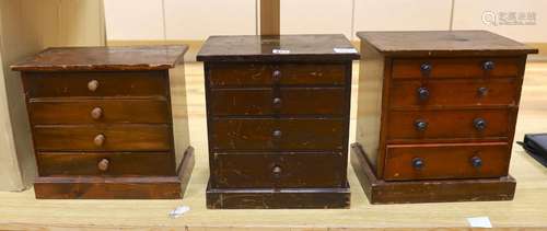 Three miniature four drawer collectors chests, tallest 33cms...