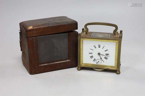 A lacquered brass carriage clock, 12cm wide, cased