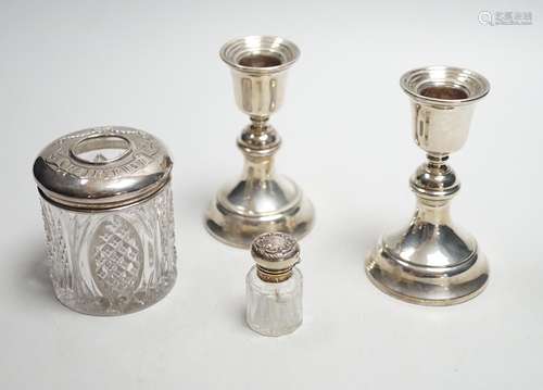 A pair of 1930s silver mounted dwarf candlesticks, 10cm, a s...