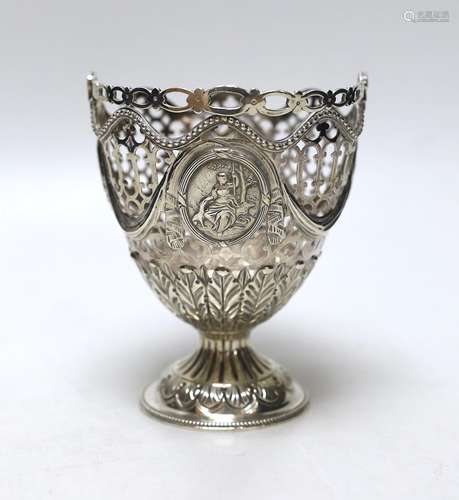 A George III pierced silver vase shaped sugar basket, lackin...