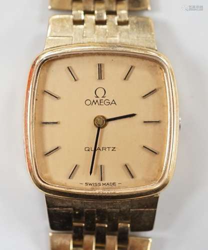 A ladys 9ct gold Omega quartz wrist watch, on a 9ct gold Ome...