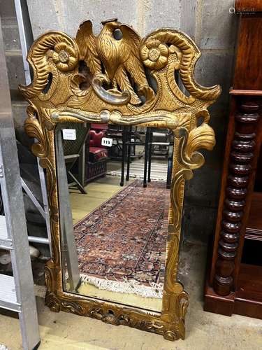 An 18th century style carved giltwood wall mirror, width 62c...