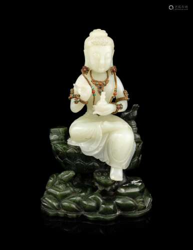 A Pale Celadon and Spinach Jade Figure of Guanyin
