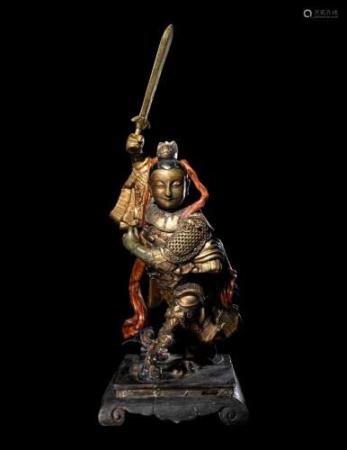 A Gilt and Lacquered Wood Figure of a Guardian