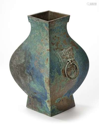 A CHINESE BRONZE SQUARE-SECTION TWIN-HANDLED HU VASE, HAN DY...