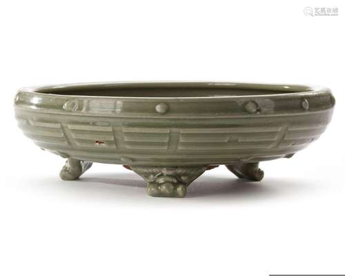 A CHINESE LONGQUAN CELADON 'EIGHT TRIGRAMS' TRIPOD CENSER LA...