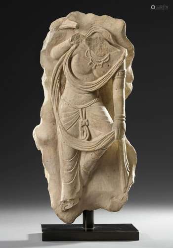 A CHINESE SANDSTONE FIGURE OF A STANDING BODHISATTVA, TANG D...