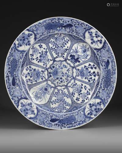 A LARGE CHINESE BLUE AND WHITE PEACOCK CHARGER, KANGXI PERIO...