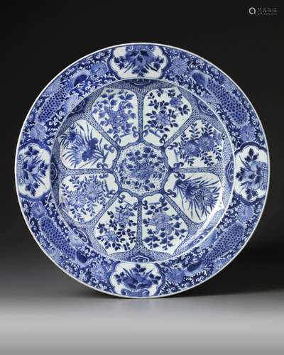 A LARGE CHINESE BLUE AND WHITE PEACOCK CHARGER, KANGXI PERIO...