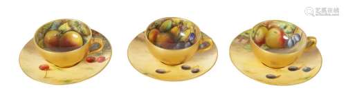 A SET OF THREE FRUIT ROYAL WORCESTER COFFEE CUPS AND SAUCERS...