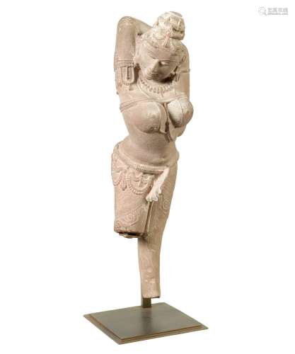 A 12TH CENTURY CARVED RED SANDSTONE NORTHERN INDIAN APSARA F...