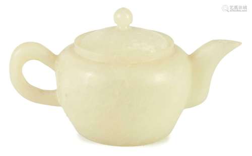 A CHINESE CARVED JADE TEAPOT