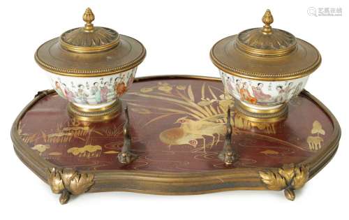 A 19TH CENTURY DARK RED AND GOLD LACQUER WORK ORMOLU MOUNTED...