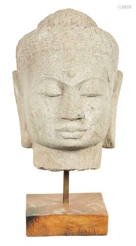 A LARGE CARVED STONE TIBETAN BUDDHIST HEAD