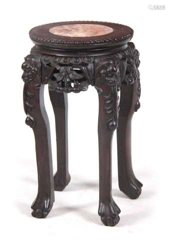 A SMALL 19TH CENTURY PROFUSELY CARVED CHINESE HARDWOOD CIRCU...