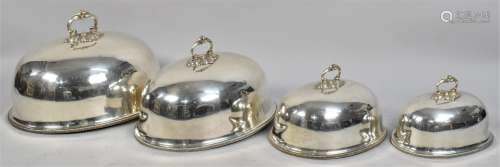 A Set of Four Edwardian Graduated Silver Plated Meat Covers,...