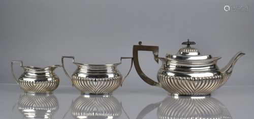 A George V Silver Three Piece Tea Service by William Aitken,...