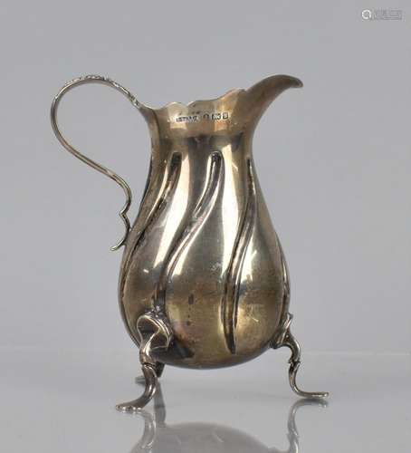 An Edward VII Silver Cream Jug of Wyrthen Form raised on Tri...