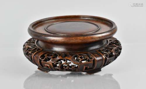 A Chinese Hardwood Stand of Circular Form having Moulded and...