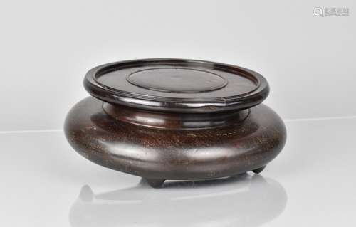 A Chinese Huanghuali Wood Vase Stand of Turned Circular Form...