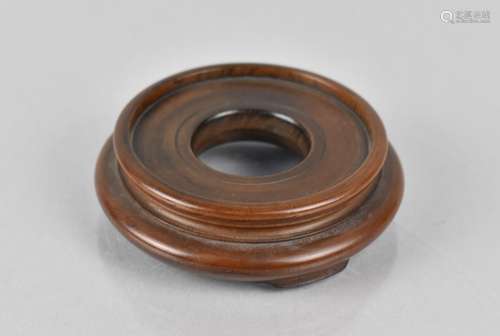 A Small Chinese Turned Hardwood Stand, 6cms Diameter