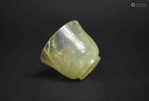 A Carved Jade Cup of Round Plain Funnel Form on Circular Foo...