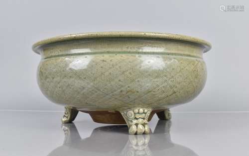 An Early and Large Chinese Celadon Tripod Censer with Incise...