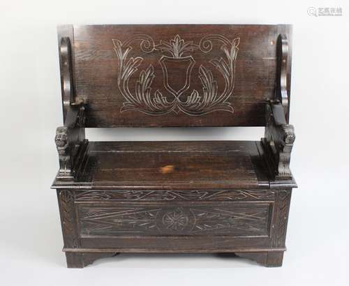 A Mid 20th Century Oak Monks Bench with Carved Lion Ends, 10...