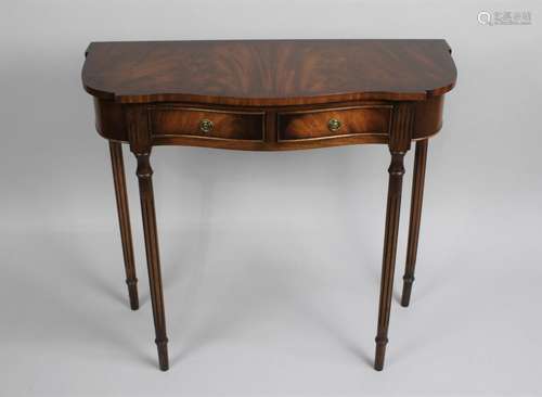 A Reprodux Mahogany Serpentine Front Side Table with Two Sma...