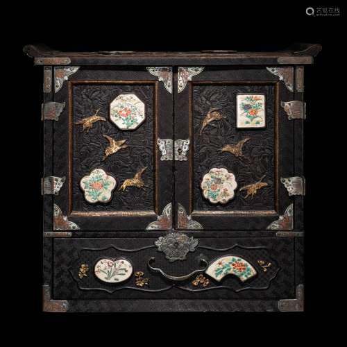 A Japanese Porcelain and Metal Inset Wood Chest