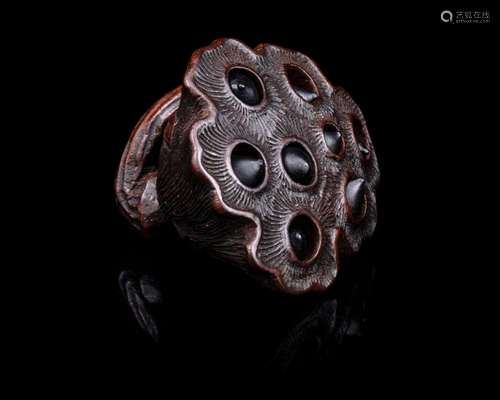 A Japanese Wood Netsuke of Lotus Pod