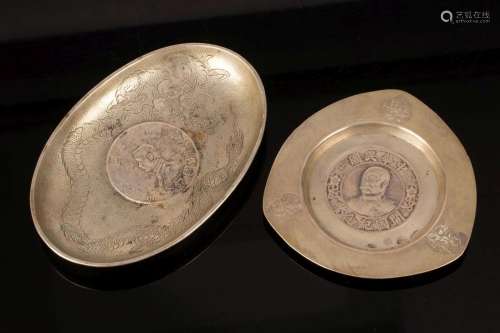 Two small 20th Century Chinese silver trays, the largest ova...