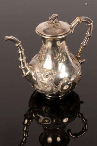 A Chinese silver teapot, 19th/20th Century, decorated with f...
