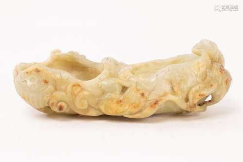 A Chinese celadon jade water vessel carved in the form of li...