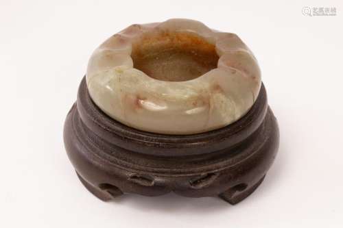 A Chinese celadon jade water vessel carved in the form of a ...