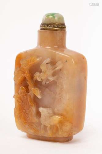 A Chinese jade carved snuff bottle, Qing Dynasty, one side d...