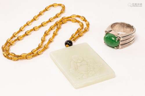 A Chinese jadeite and silver ring and a jade carved plaque, ...
