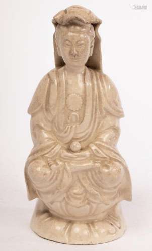 A Chinese monochrome glazed porcelain figure of Guanyin, 19/...