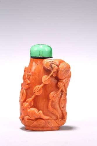 A CHINESE RED CORAL 'LIUHAN AND GOLDEN TOAD' SNUFF BOTTLE