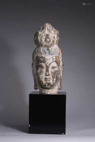 A CHINESE PAINTED GREY STONE HEAD OF GUAN YIN