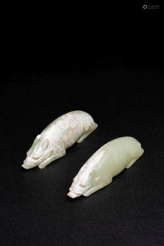 A PAIR OF CHINESE CALCIFIED CELADON JADE PIGS