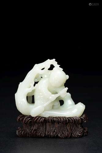 A WHITE JADE 'BOY IN A RAFT' CARVING