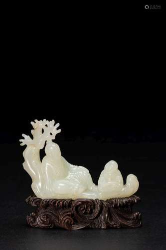 A WHITE JADE CARVING OF A 'RAFT' GROUP