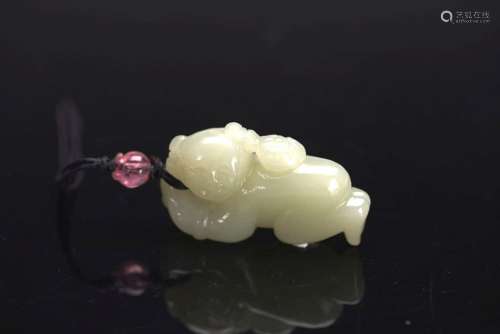 A WHITE JADE 'BOY AND LOTUS' PENDANT