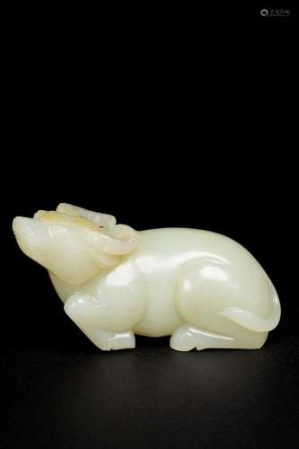 A WHITE JADE RECUMBENT BUFFALO