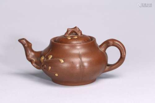 A YIXING ZISHA PLUM BLOSSOM TEAPOT