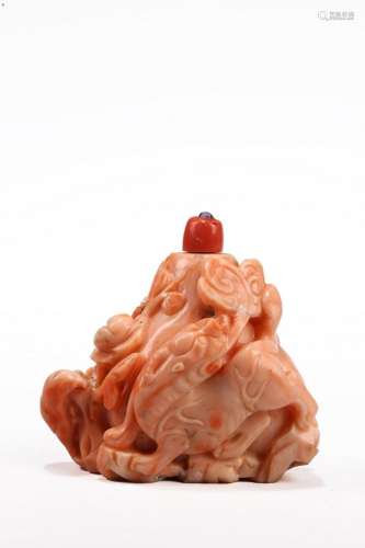 A CHINESE CORAL CARVED 'QILIN' SNUFF BOTTLE
