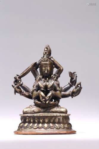 A COPPER ALLOY FIGURE OF