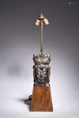 A CHINESE BLACK LIMESTONE 'GUANYIN' HEAD WITH STAND